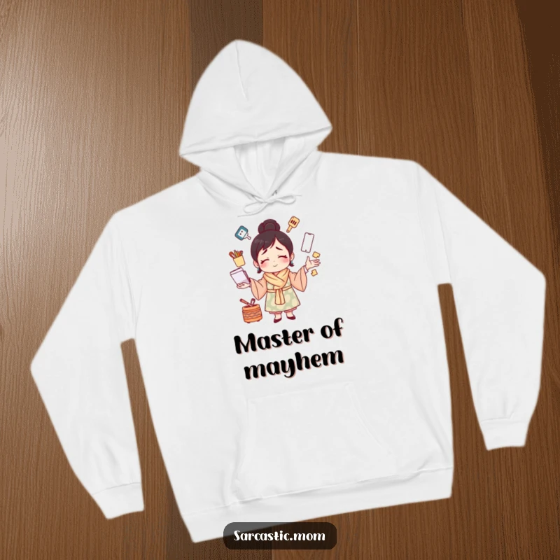Funny hoodie with a mother figure juggling many tasks with a strained smile, offering cozy humor for the wonderfully busy mom.