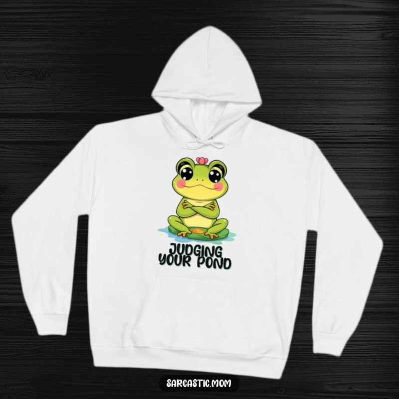 Funny Frog Mom Hoodie: A frog mom stands with crossed arms, giving a disapproving look to a messy lily pad.