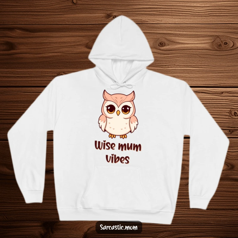 Funny and cozy hoodie featuring an owl mom character with prominent wide eyes and a pursed beak, symbolizing watchful and humorous maternal love.