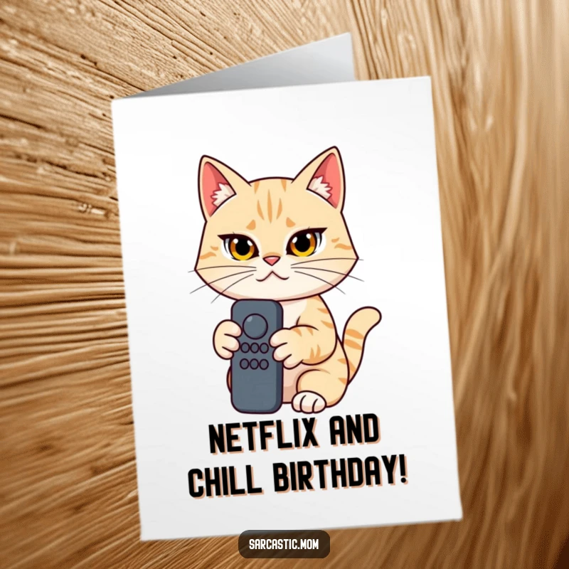 Funny Free Printable Birthday Card: Cat mom with a determined look clutches a remote, ready to conquer the channels on her birthday.