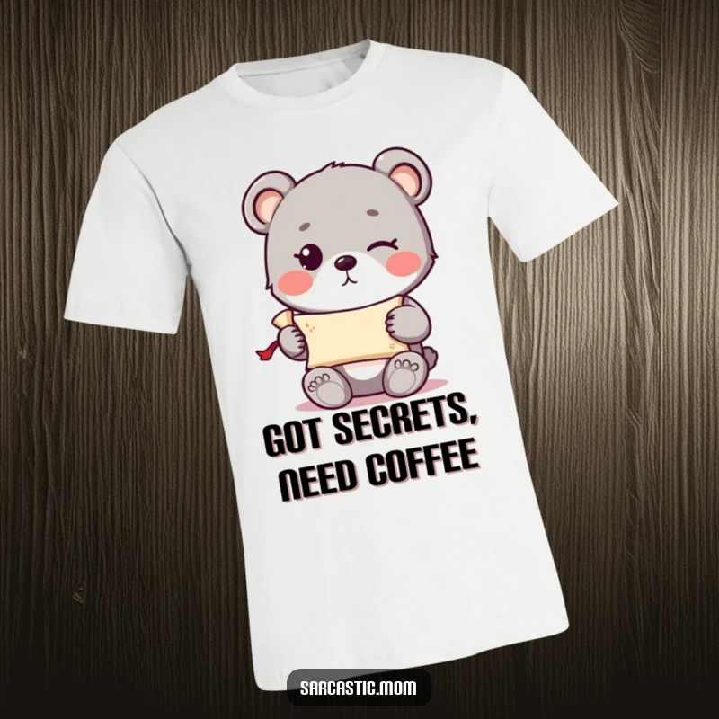 Funny cute bear cub with a knowing wink holding a tiny rolled-up scroll on a comfortable t-shirt.